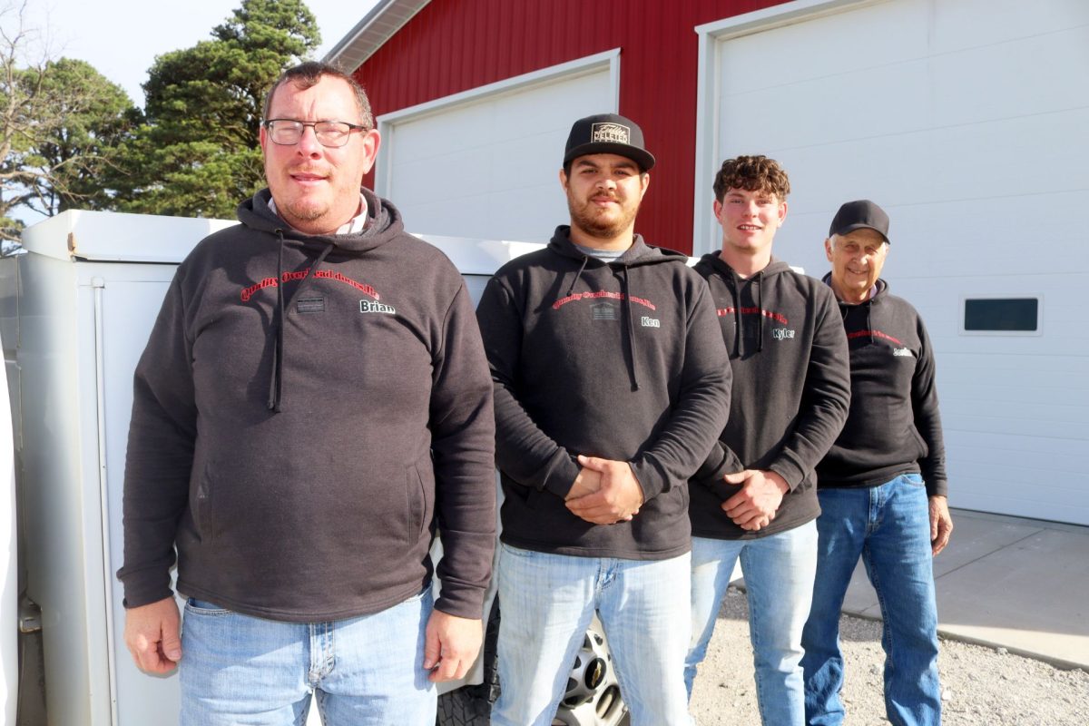 Brian Knepp, owner of Quality Overhead Door LLC in Seymour, Missouri, standing with three employees