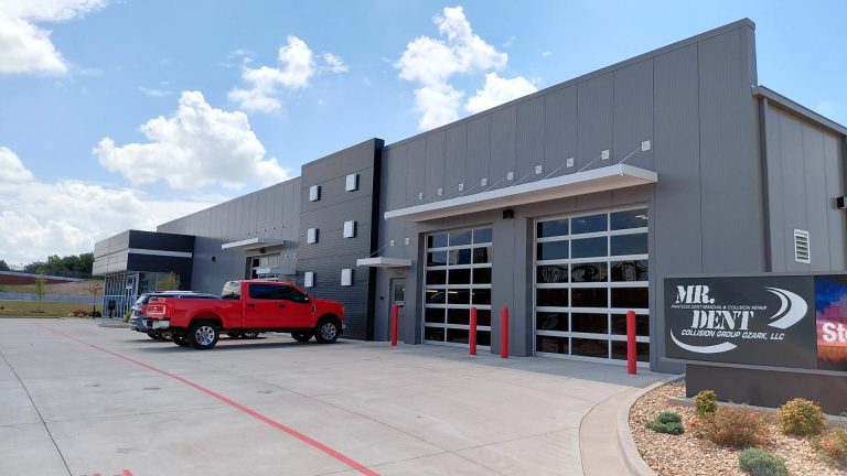 Commercial overhead door installation project in Ozark Missouri featuring glass panels.
